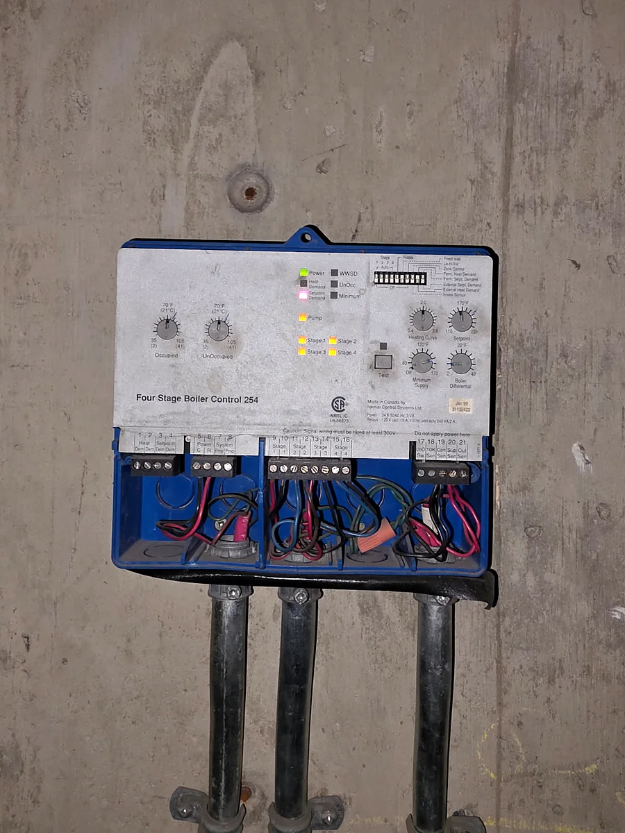 Original 1999 four stage boiler control before replacement by PeakFlow Plumbing Calgary