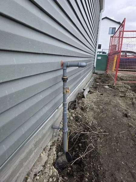 Exterior gas line installation by PeakFlow Plumbing Calgary