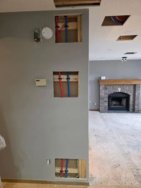 PEX piping through walls - residential plumbing by PeakFlow Calgary